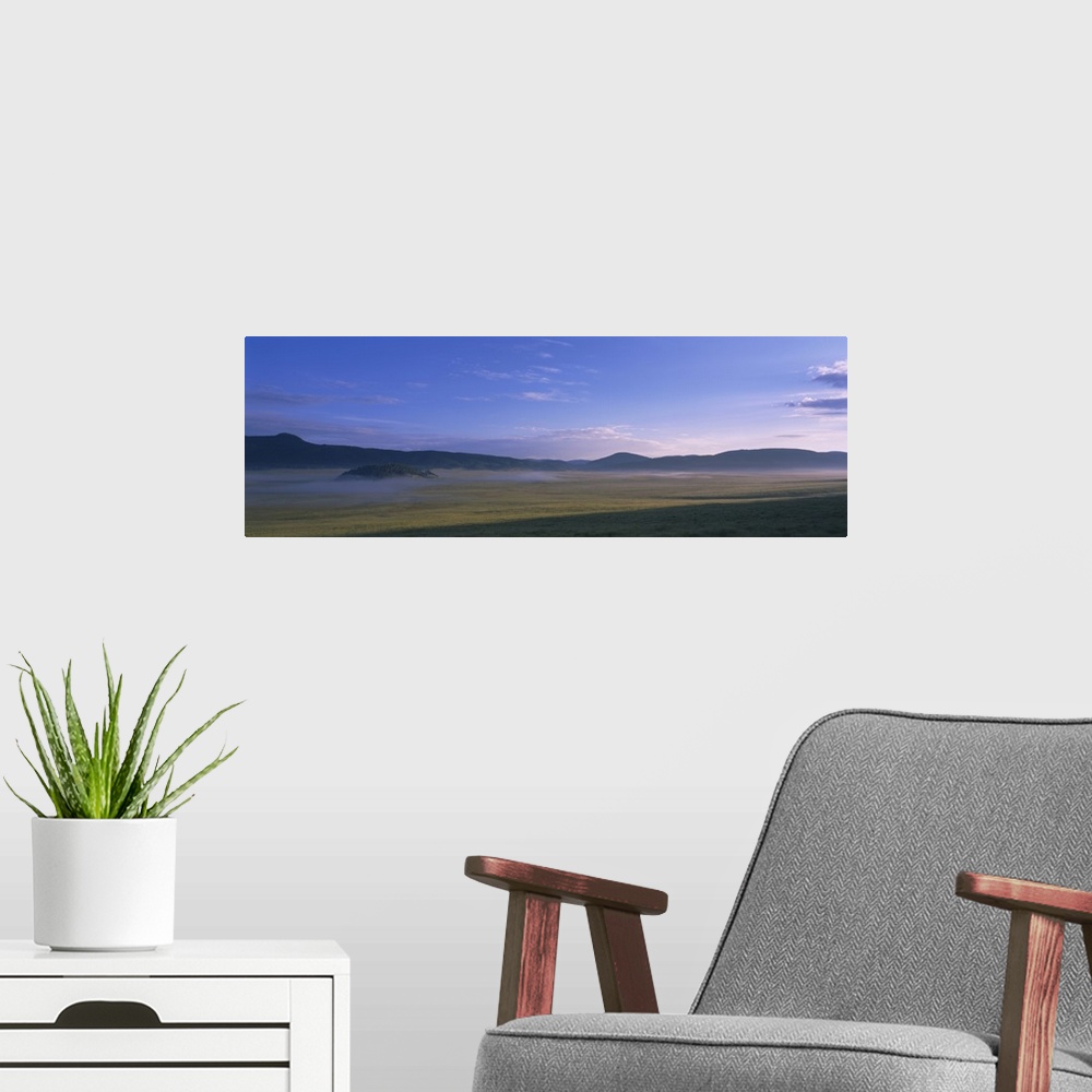 A modern room featuring Landscape with mountains in the background, Valle Grande, Valles Caldera National Preserve, Redon...