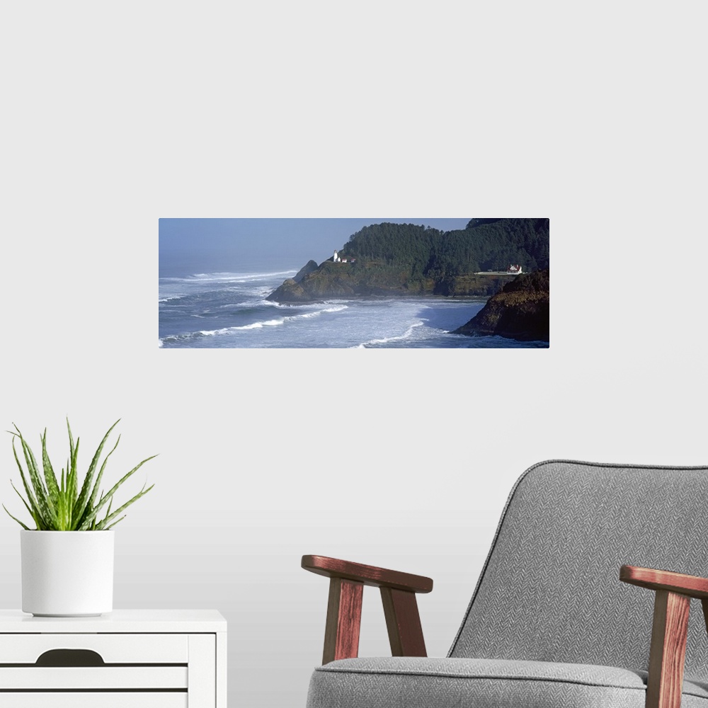 A modern room featuring Large, landscape photograph of waves rushing against the shore in Heceta Head, Lane County, Orego...