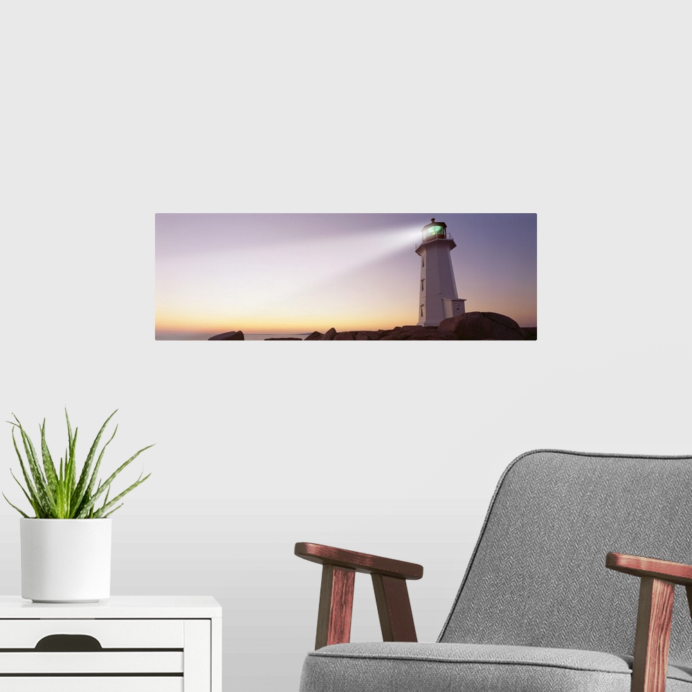 A modern room featuring This panoramic piece is a picture taken of a lighthouse that sits on a rocky cove and shines out ...