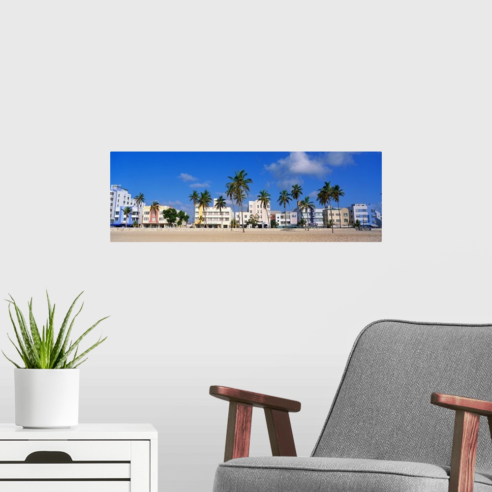 A modern room featuring Gigantic panoramic photo of Miami Beach, Florida with the sandy beach, palm trees, and buildings ...