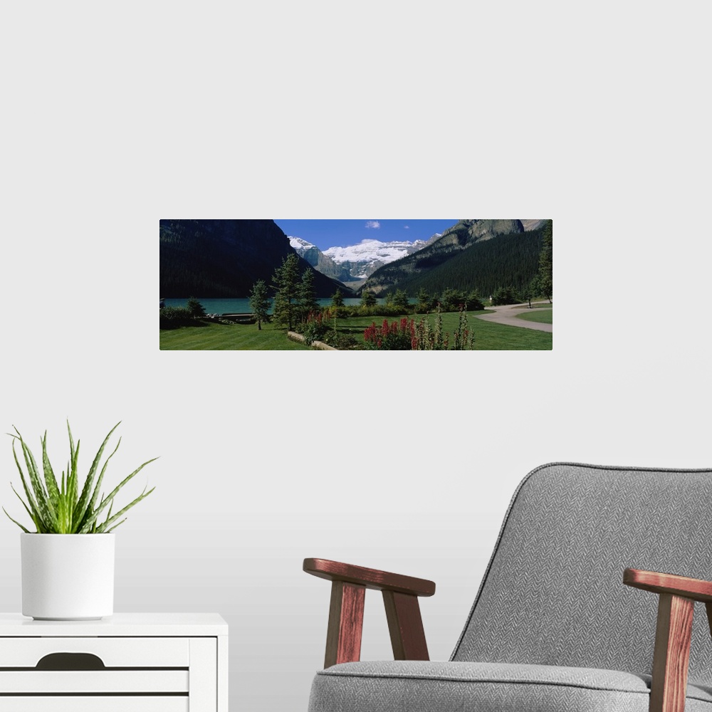A modern room featuring Mountains surrounding a lake, Lake Louise, Canadian Rockies, Alberta, Canada
