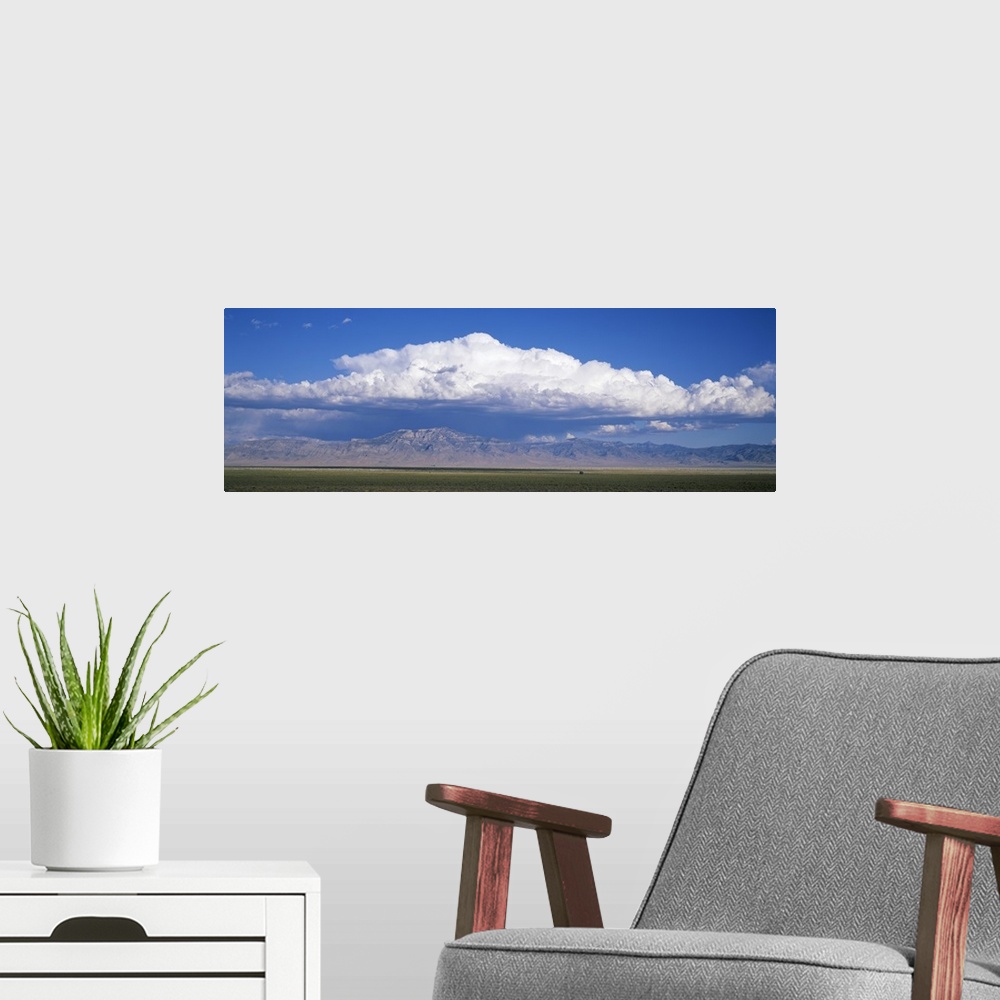 A modern room featuring Mountains w\ cumulus clouds NV