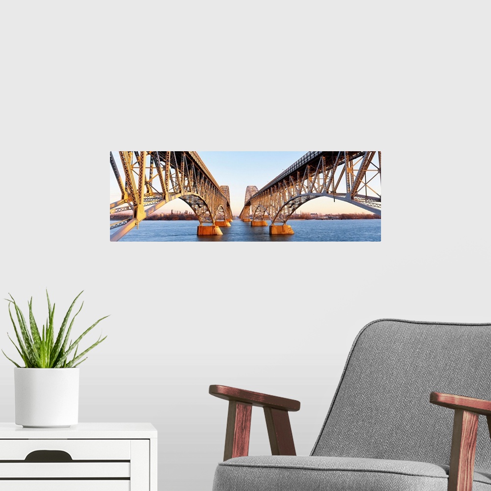 A modern room featuring New York, South Grand Island Bridges