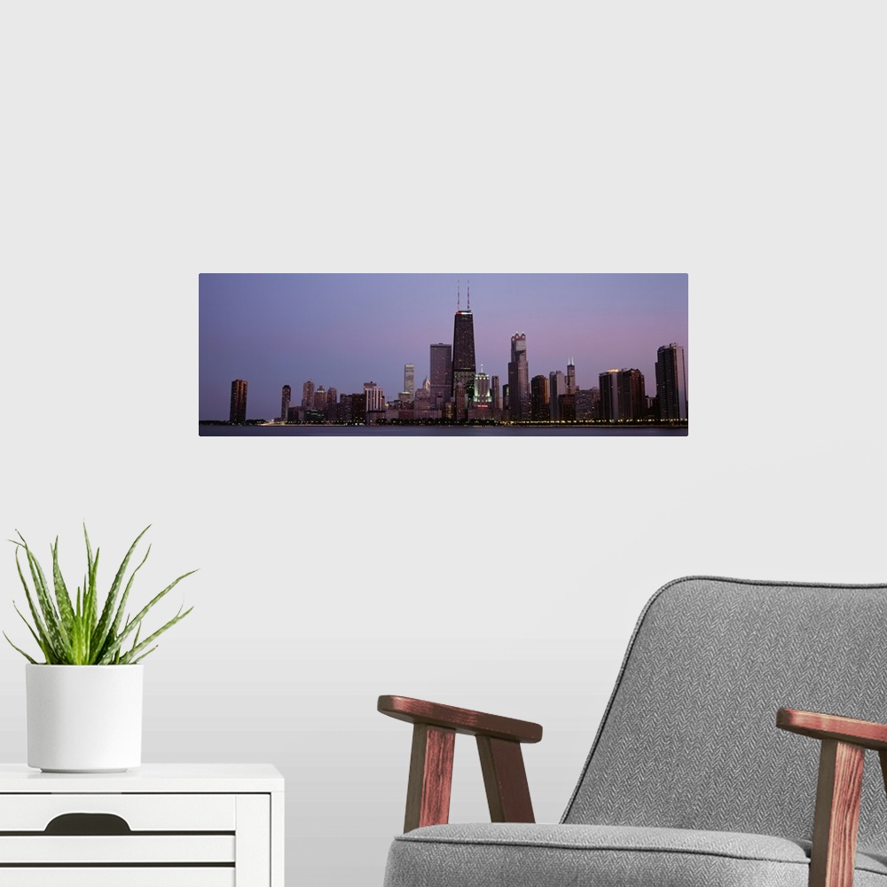 A modern room featuring Night skyline Chicago IL