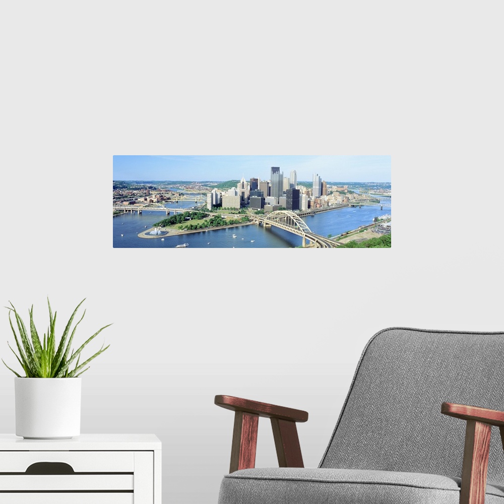 A modern room featuring Panoramic photograph taken from an aerial view overlooking a busy skyline in the Northeastern Uni...