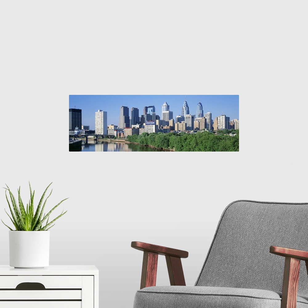 A modern room featuring Panoramic photograph taken of downtown Philadelphia on a sunny day.