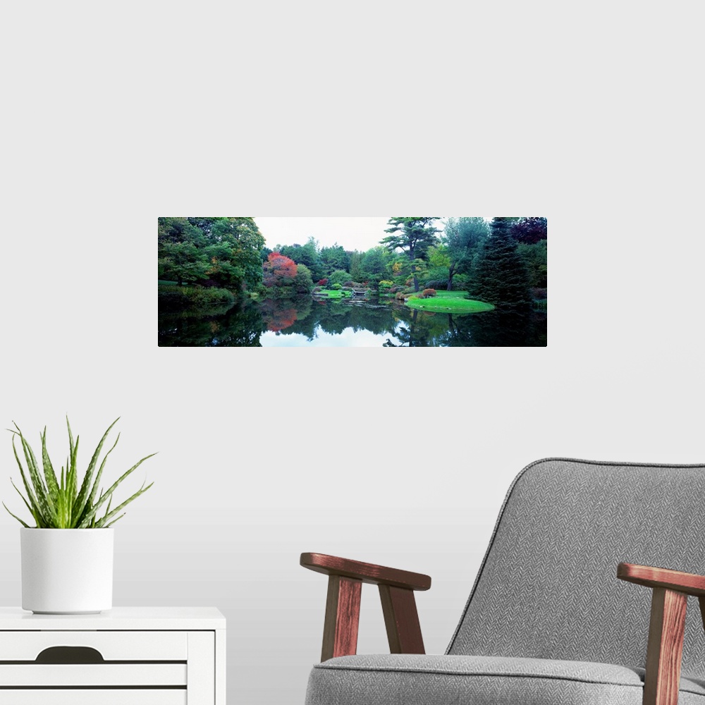 A modern room featuring Panoramic photograph of the vibrant Asticou Azalea Garden reflecting in the water of a large pond...