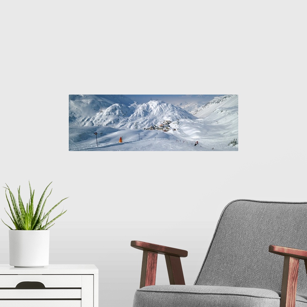 A modern room featuring Rear view of a person skiing in snow, St. Christoph, Austria