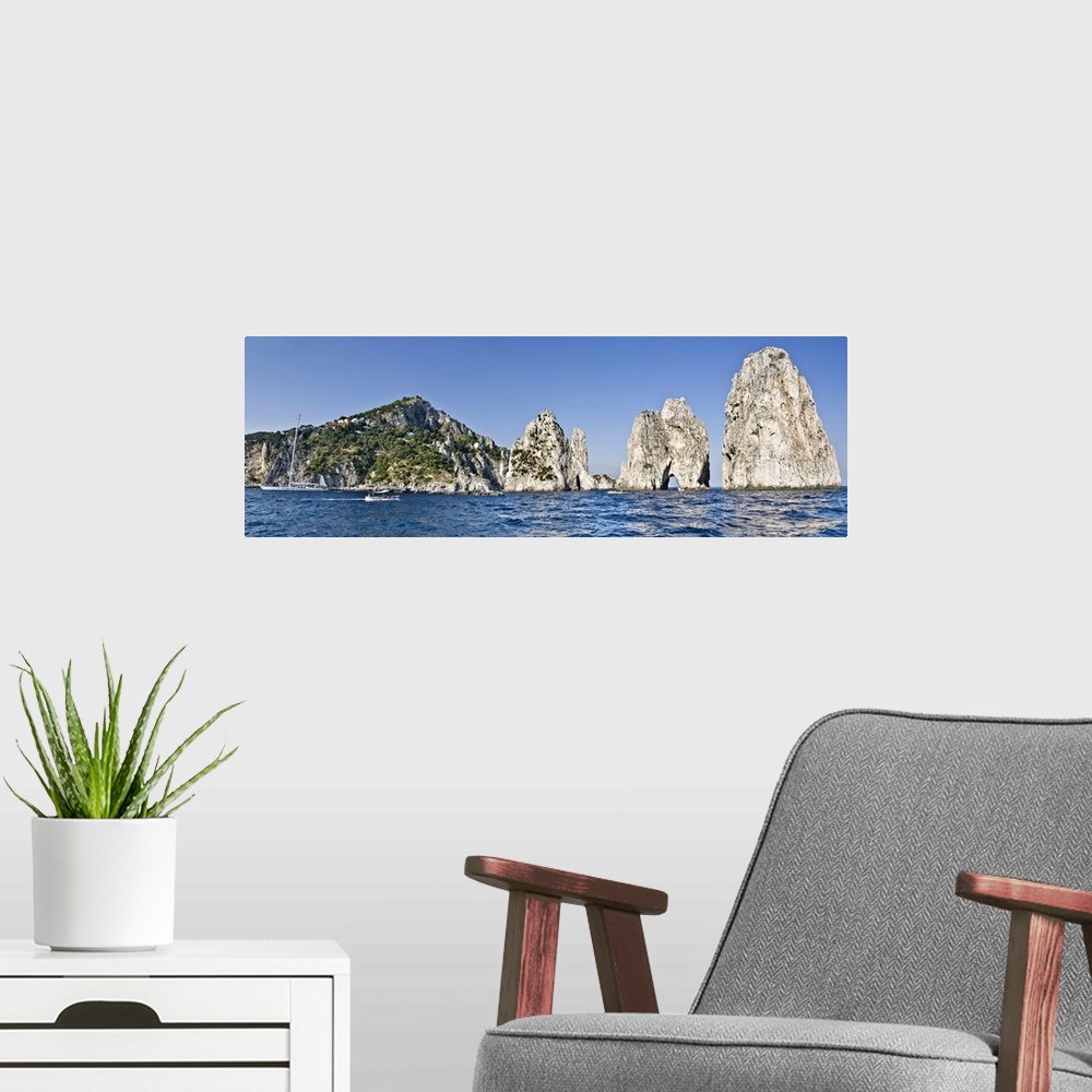 A modern room featuring Rock formations in the sea Faraglioni Capri Naples Campania Italy