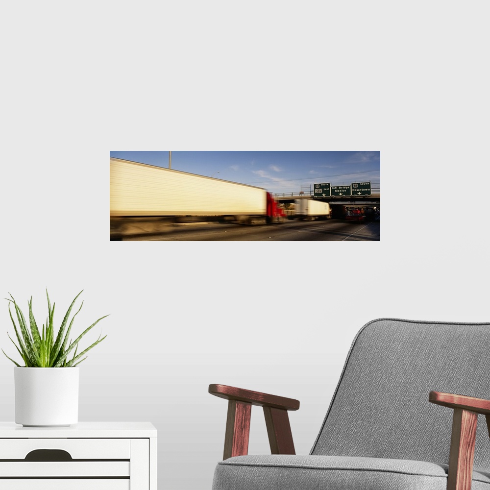 A modern room featuring Semi-trucks on a highway, Laredo, Texas