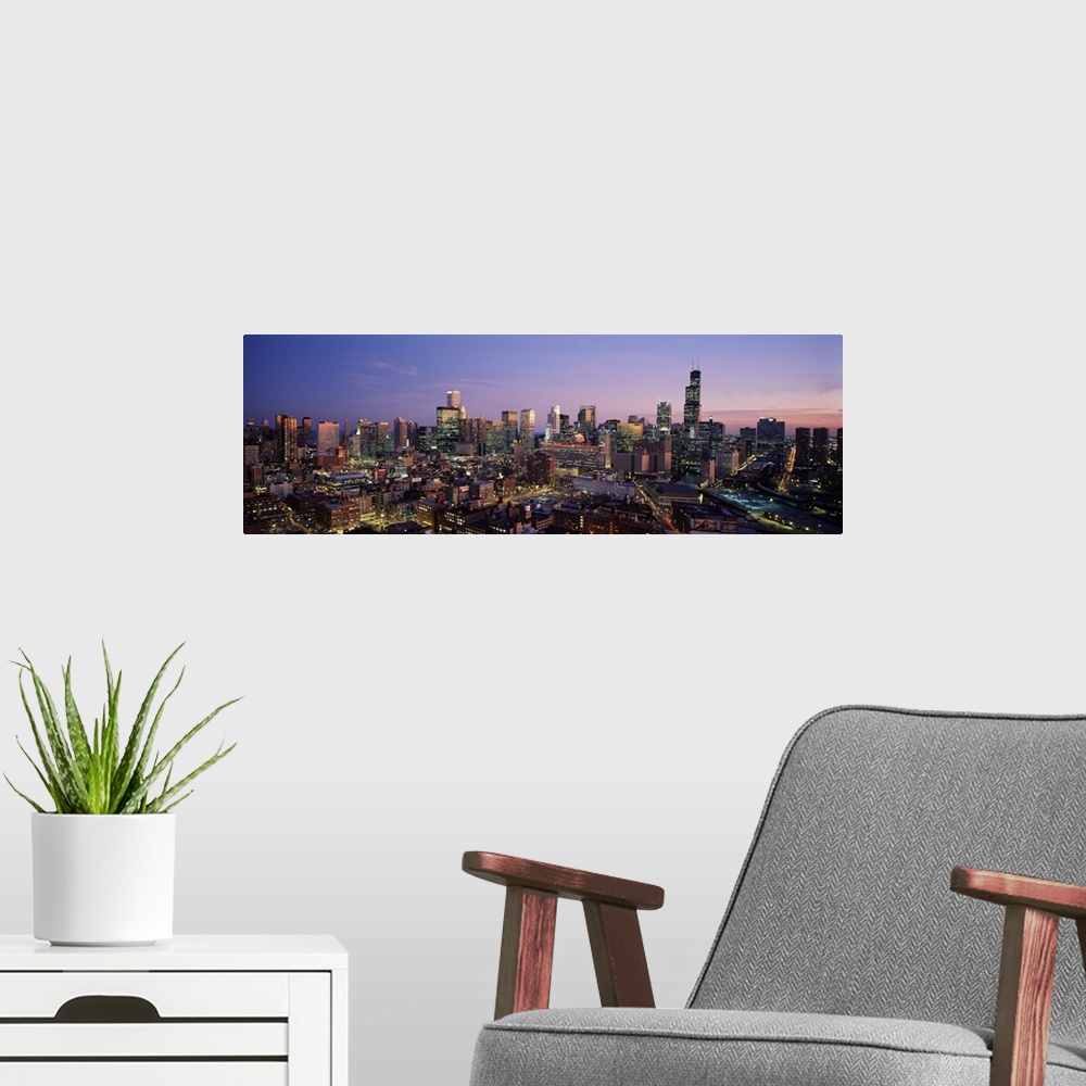 A modern room featuring Skyscrapers in a city lit up at dusk, Chicago, Illinois