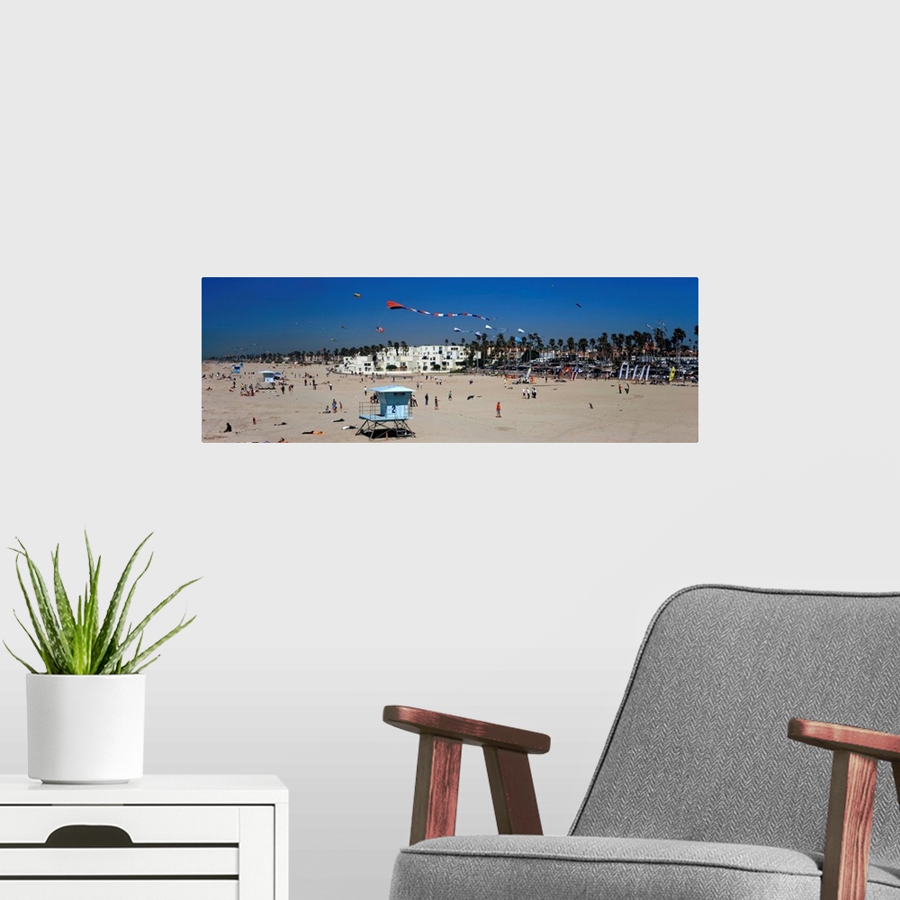 A modern room featuring Tourists on the beach Huntington Beach Orange County California