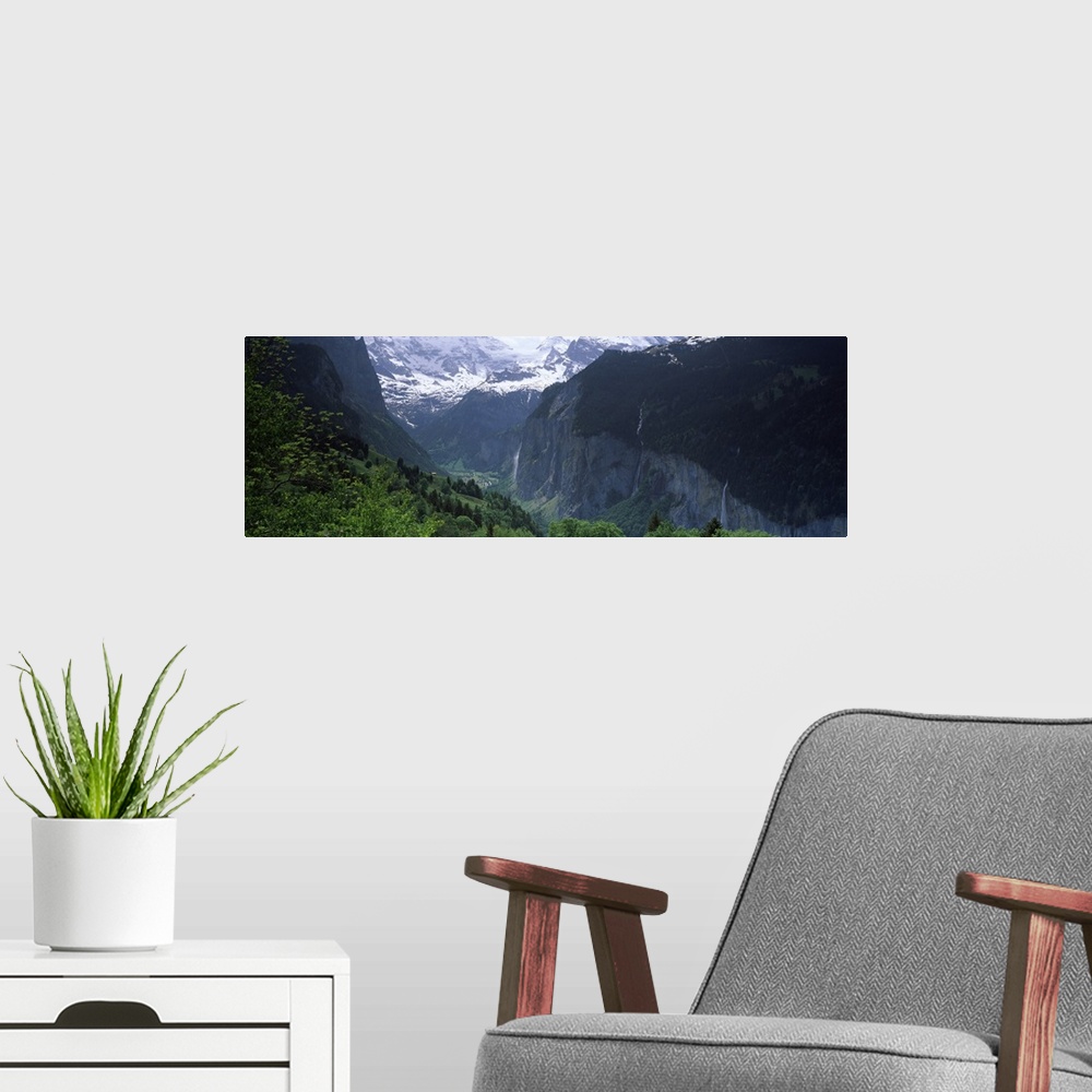 A modern room featuring Waterfalls in a forest Lauterbrunnen Valley Wengen Bernese Oberland Berne Canton Switzerland