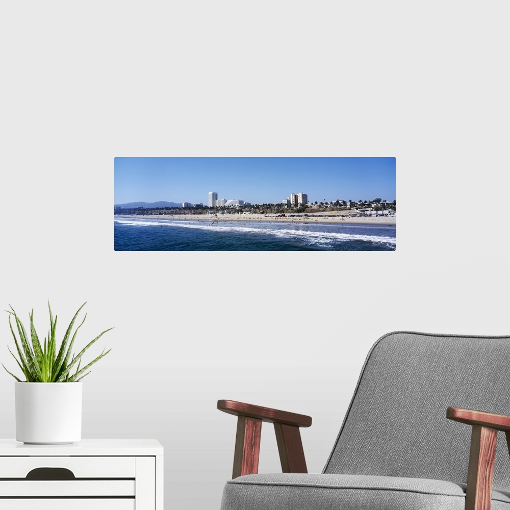 A modern room featuring Waves on the beach with buildings in the background, Santa Monica Beach, Santa Monica, California
