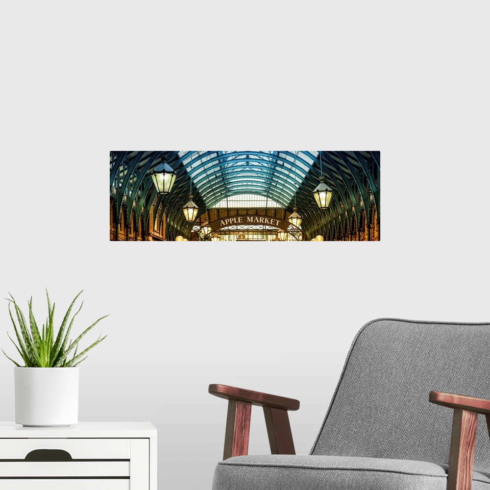 A modern room featuring Panoramic image of the arches and hanging lamps in Covent Garden Market.