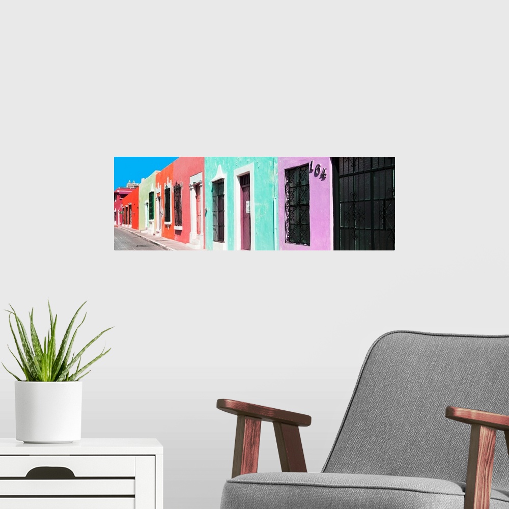 A modern room featuring Panoramic photograph of a colorful street scene in Campeche, Mexico. From the Viva Mexico Panoram...