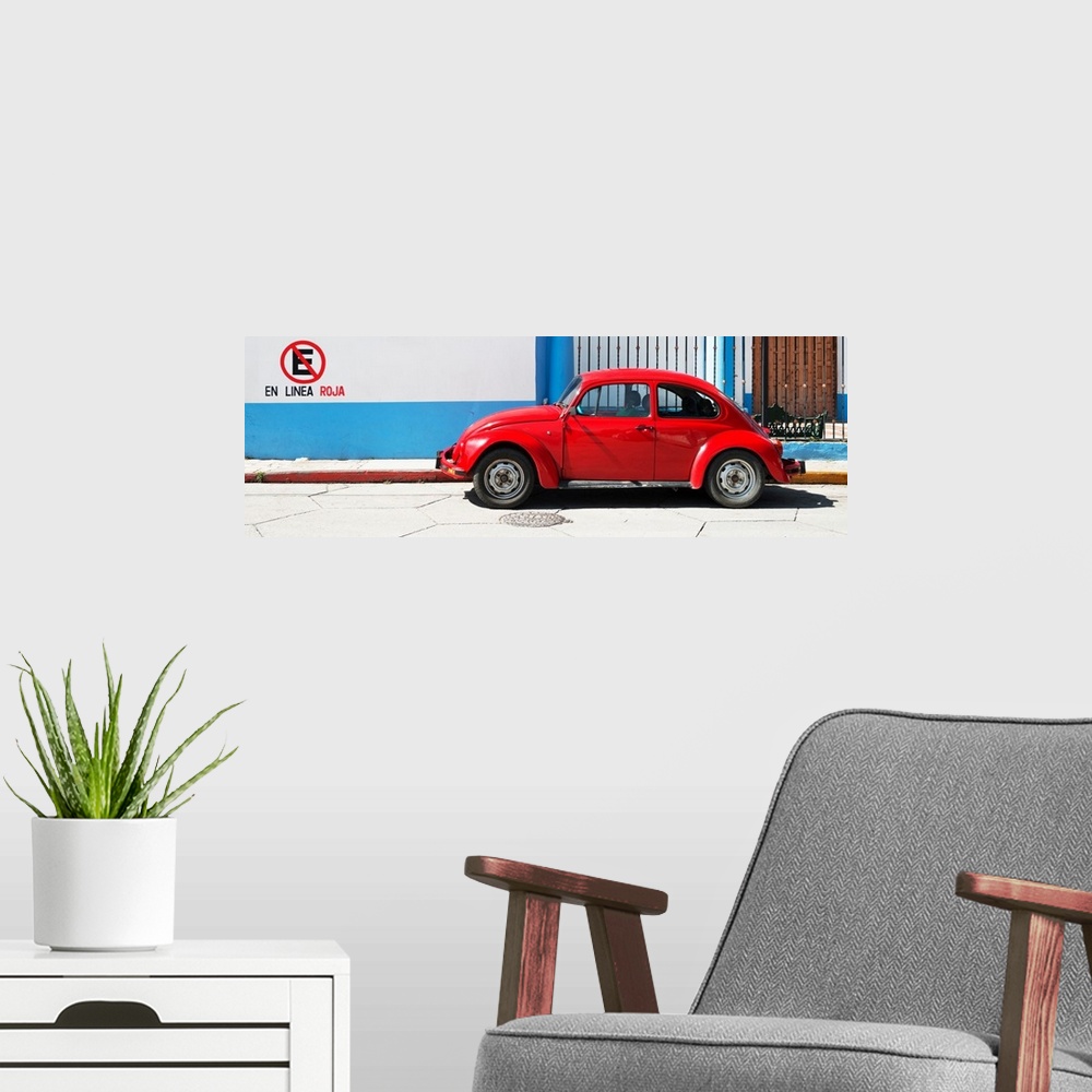A modern room featuring Panoramic photograph of a red Volkswagen Beetle parked in front of a building with blueand white ...