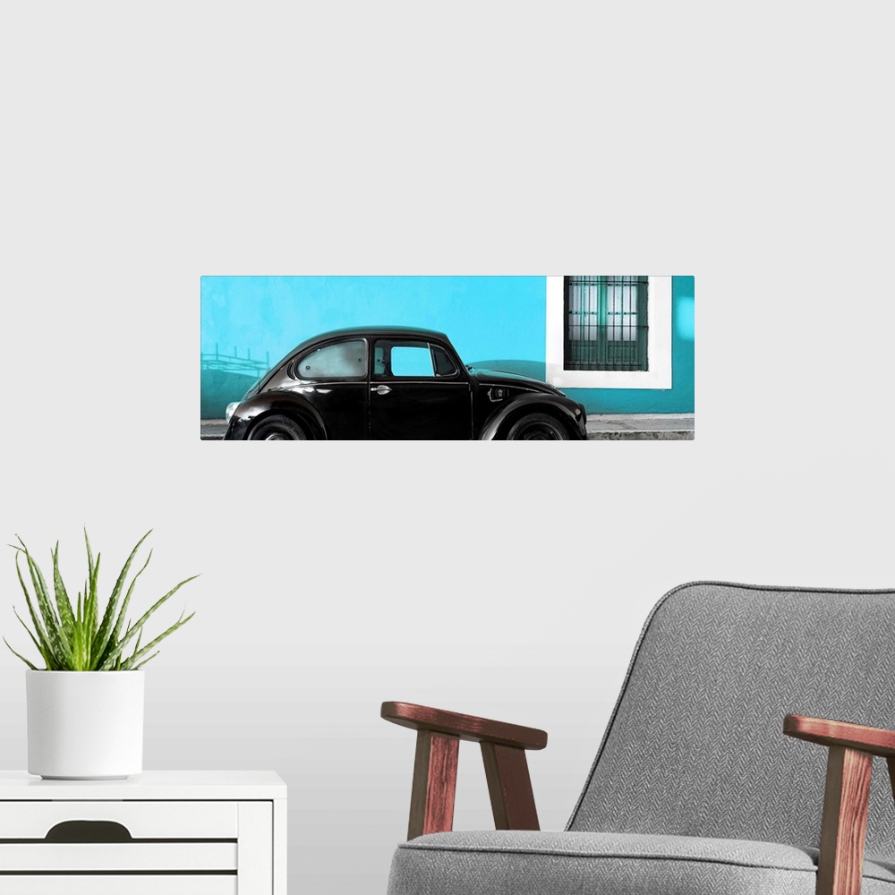 A modern room featuring Panoramic photograph of a classic black Volkswagen Beetle parked in front of a bright turquoise w...