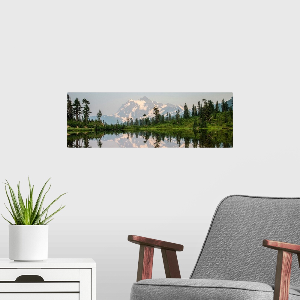 A modern room featuring Mount Shuksan is reflected in Picture Lake near Mount Shuksan, Washington.