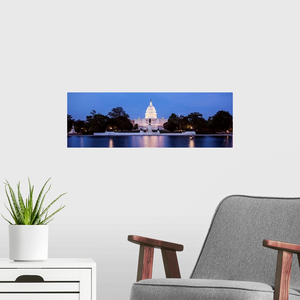 A modern room featuring Panoramic photograph of the U.S. Capitol Building at dusk with blue and magenta hues from the Cap...