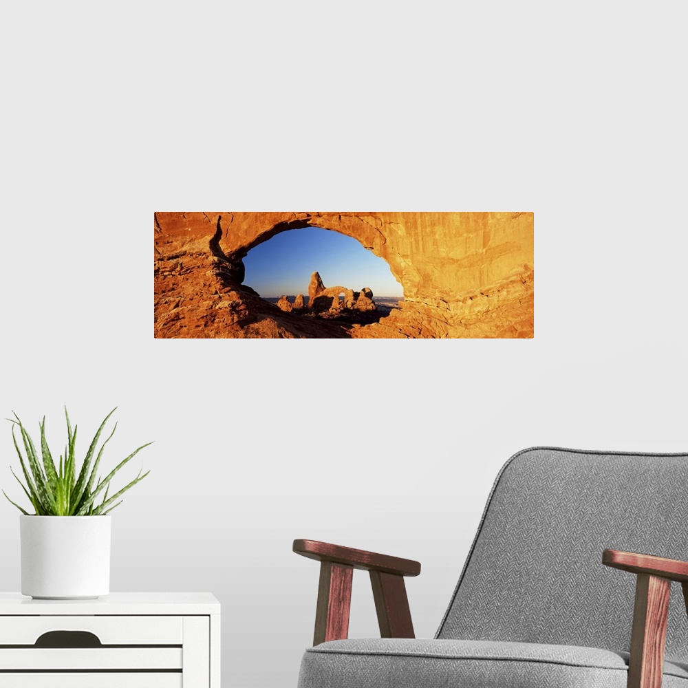 A modern room featuring Turret Arch through North Window at sunrise, Arches National Park, Moab, Utah