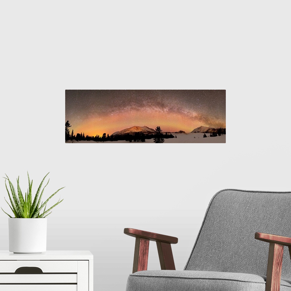 A modern room featuring Aurora borealis and Milky Way over Carcross Desert, Carcross, Yukon, Canada.
