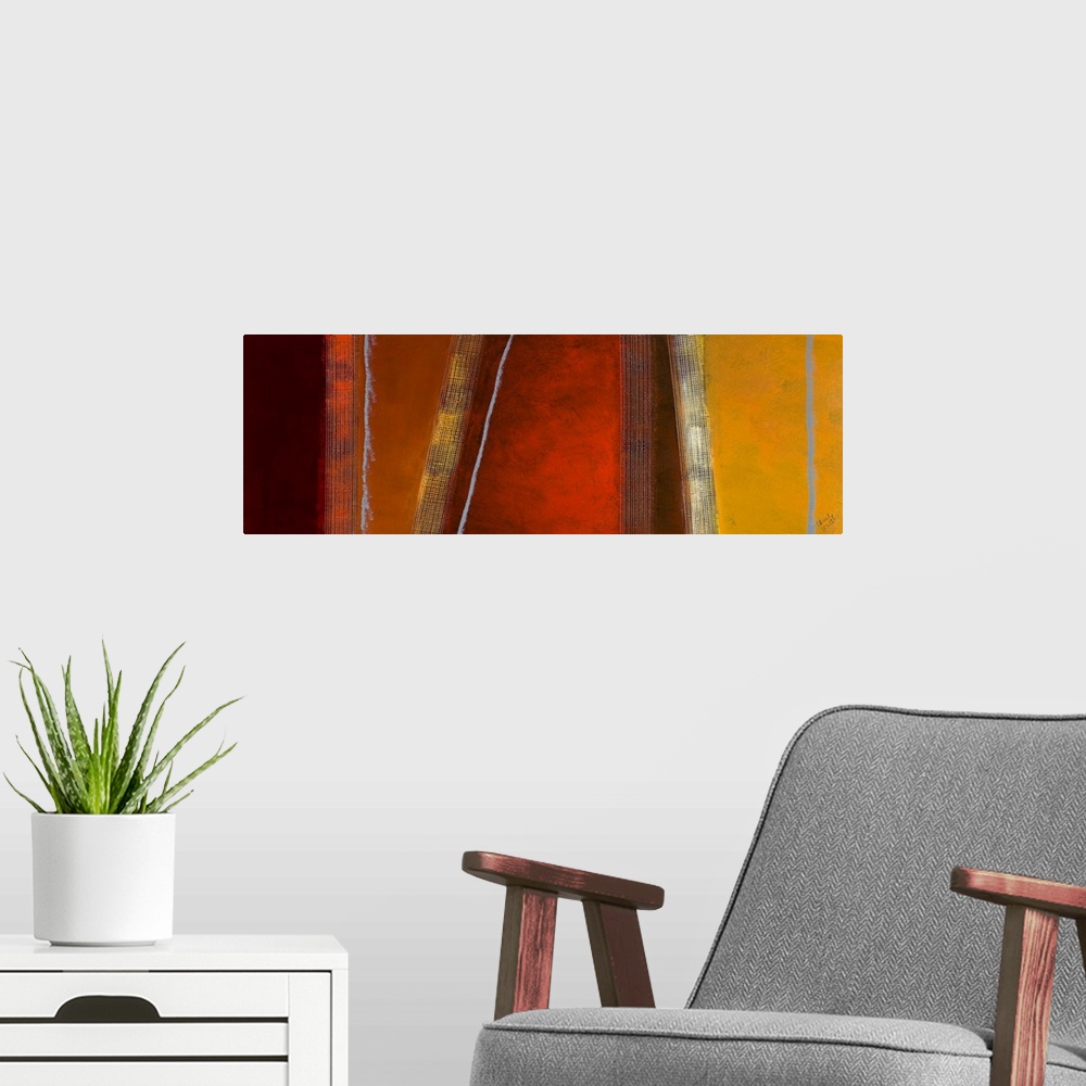 A modern room featuring Panoramic abstract art composed of different earth toned sections separated by vertical and diago...