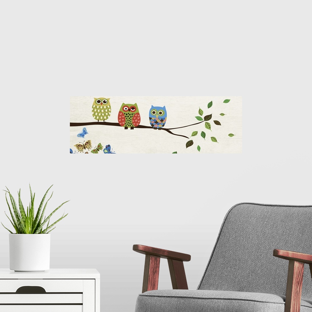A modern room featuring Contemporary artwork of owls in multiple colors perched on a branch.