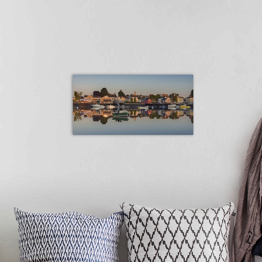 A bohemian room featuring Photograph of South Portsmouth harbor reflecting onto the clear, glassy water.