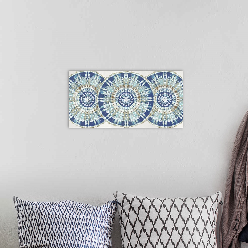 A bohemian room featuring Large abstract decor with three patterned, bohemian style circles overlapping in a row with blue,...