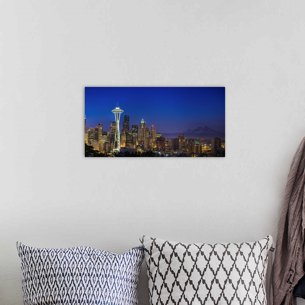 A bohemian room featuring Landscape photograph of the Space Needle and Mt Rainer in the distance.
