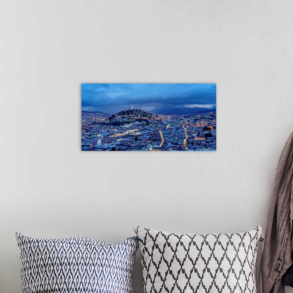 A bohemian room featuring View over Old Town towards El Panecillo Hill at twilight, Quito, Pichincha Province, Ecuador.