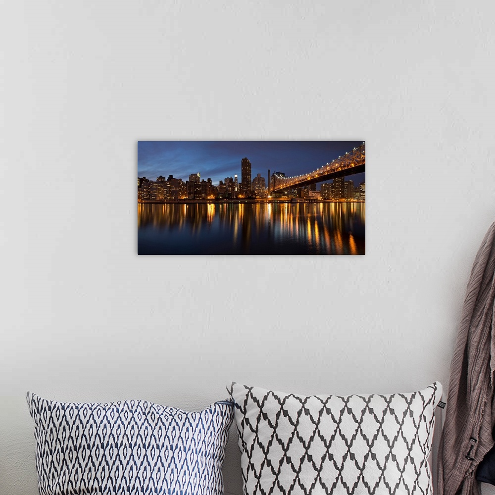 A bohemian room featuring City lit up at night, Queensboro Bridge, Roosevelt Island, Manhattan, New York City, New York Sta...