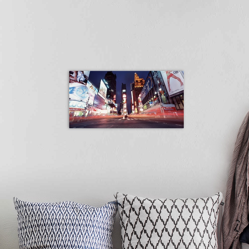 A bohemian room featuring Low-angle panorama of the lights of Times Square in downtown New York City.