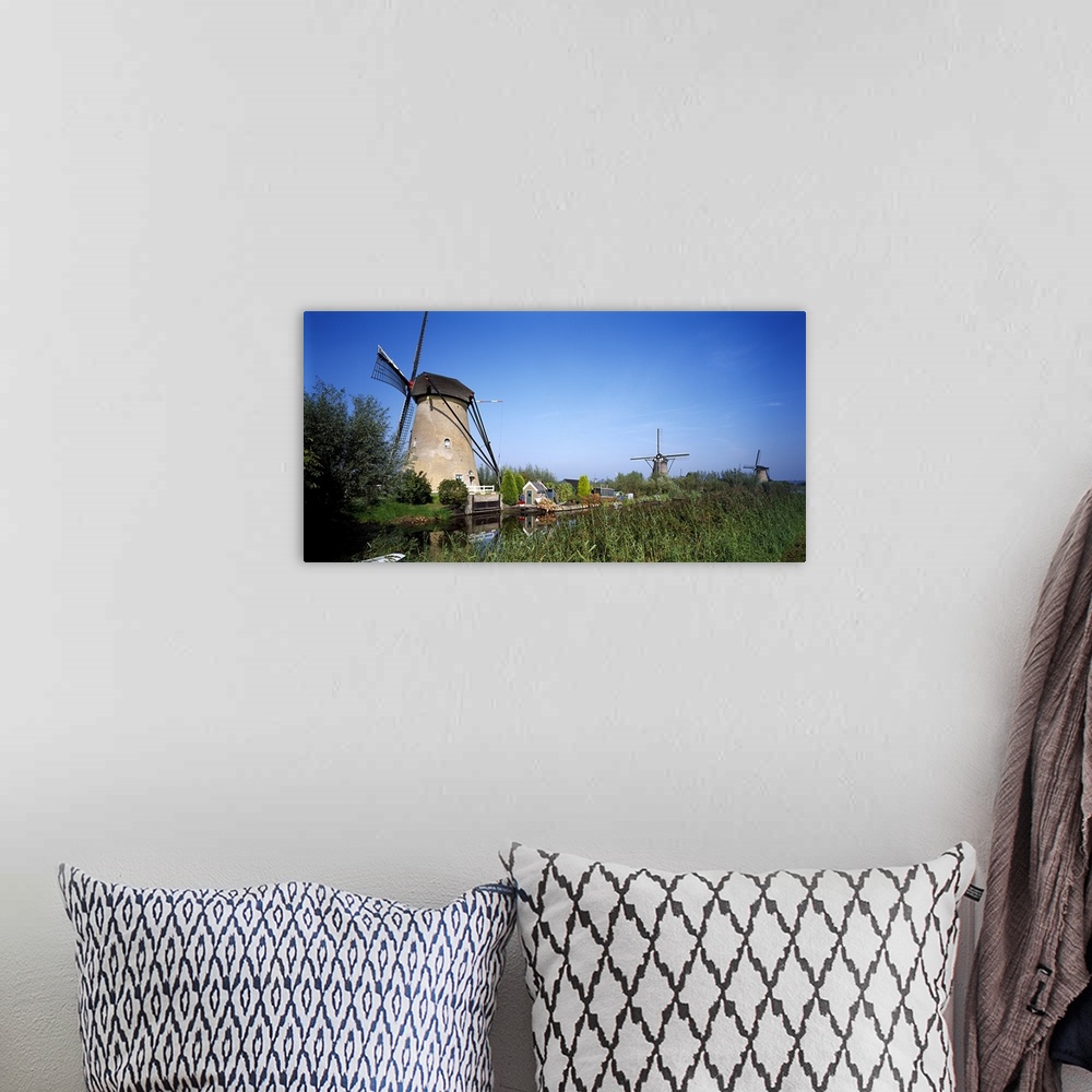 A bohemian room featuring Traditional windmills in a field, Netherlands