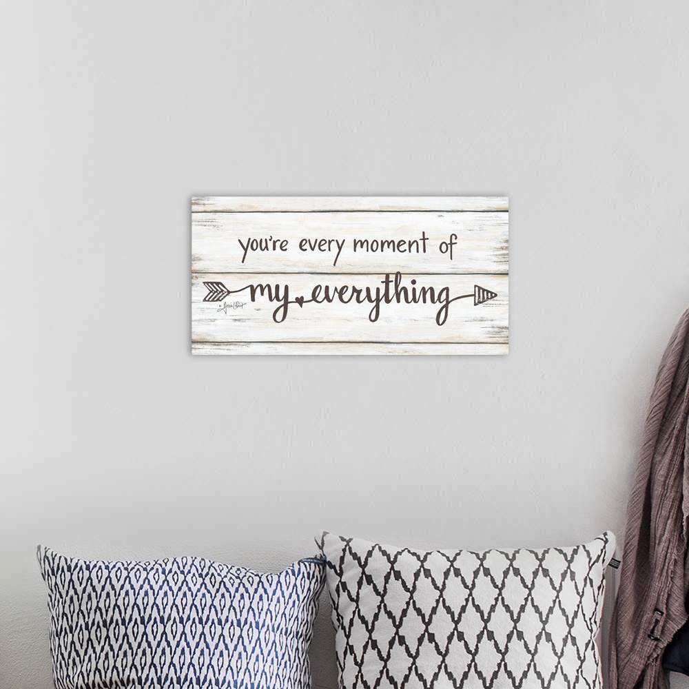 A bohemian room featuring This decorative artwork features the phrase: you're every moment of my everything, over a distres...
