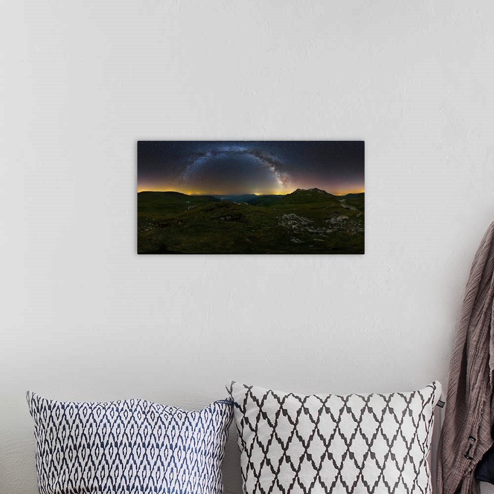 A bohemian room featuring 360 panorama of the Milky Way over Lago-Naki plateau, Russia.