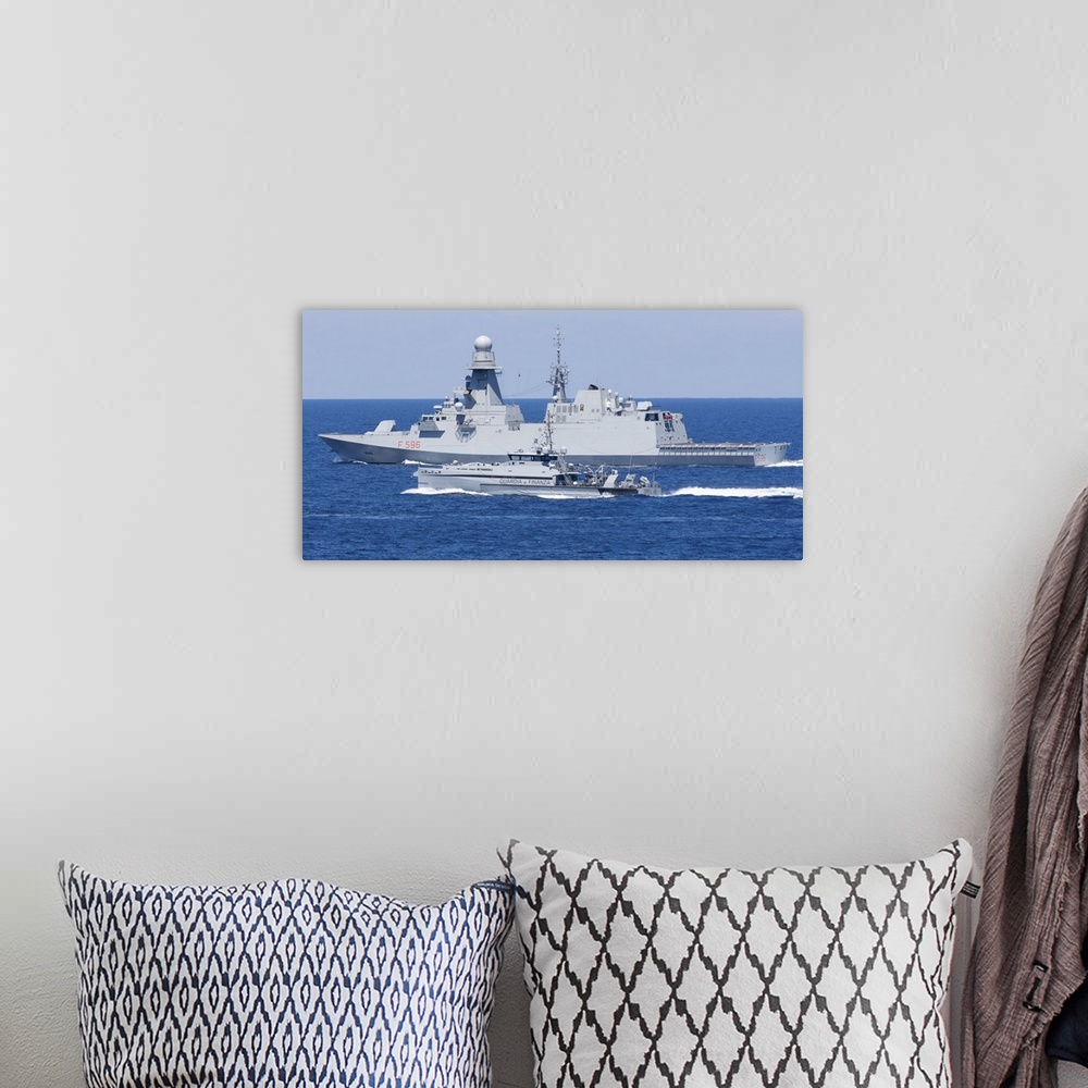A bohemian room featuring Italian Navy FREMM frigate Martinengo and the patrol boat Monte Cimone underway.