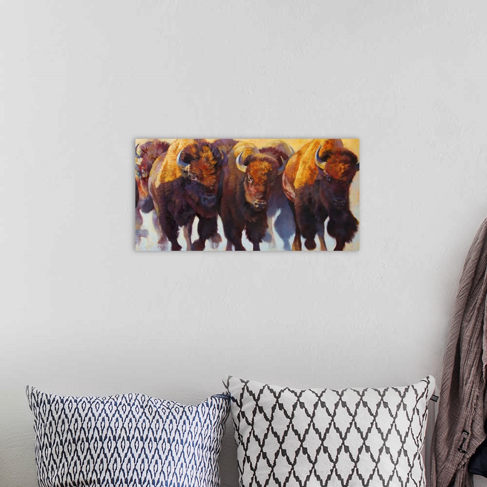 A bohemian room featuring Painting on canvas of bison and buffalos running in a pack.
