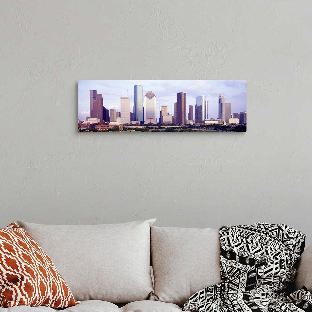 A bohemian room featuring Panoramic photograph of skyline with park in the foreground.