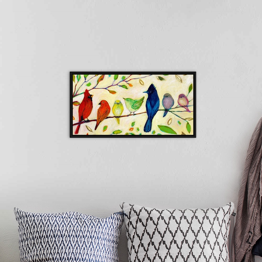 A bohemian room featuring Seven birds that chromatically shift from warm to cool colors sitting on a tree branch in this de...