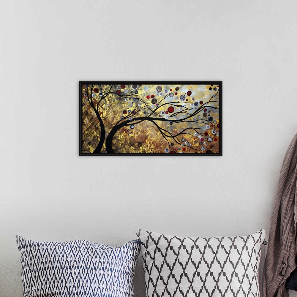 A bohemian room featuring Abstract artwork featuring two trees swaying surrounded by ciruclar and other ornate designs. Mix...