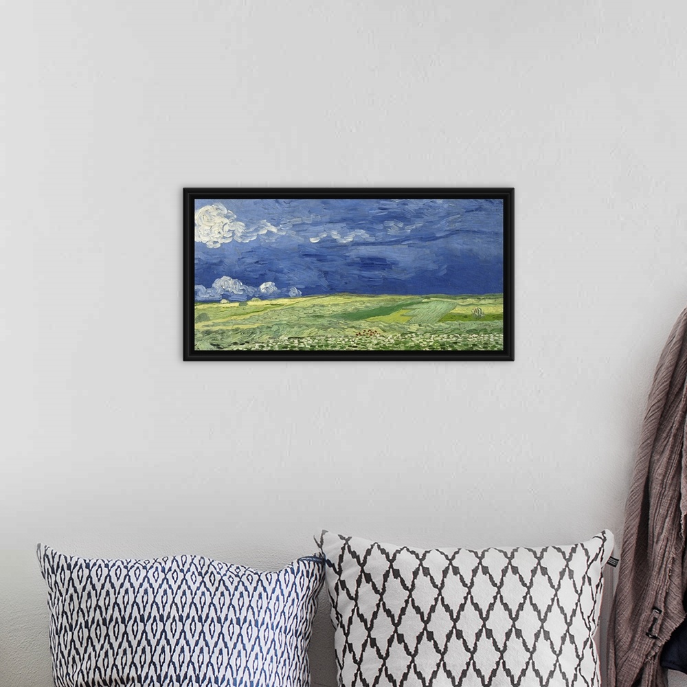 A bohemian room featuring Vincent van Gogh - Wheatfield under thunderclouds.