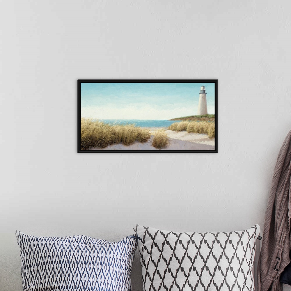 A bohemian room featuring Horizontal, large wall picture of grasses blowing on the beach.  A lighthouse in the distance, ne...