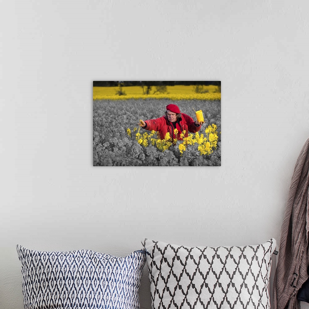 A bohemian room featuring Conceptual image of an artist painting a field of flowers yellow.