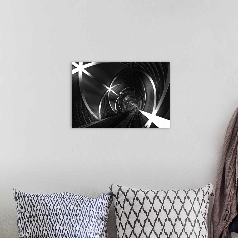 A bohemian room featuring Black and white image of a tunnel with star-shaped beams in Madrid, Spain.