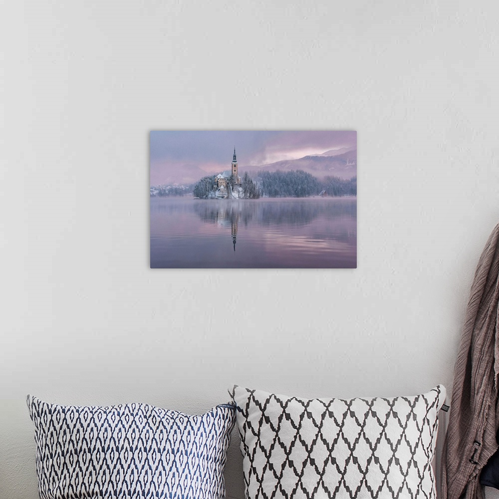 A bohemian room featuring Lake Bled with the church and the castle on a calm winter morning.