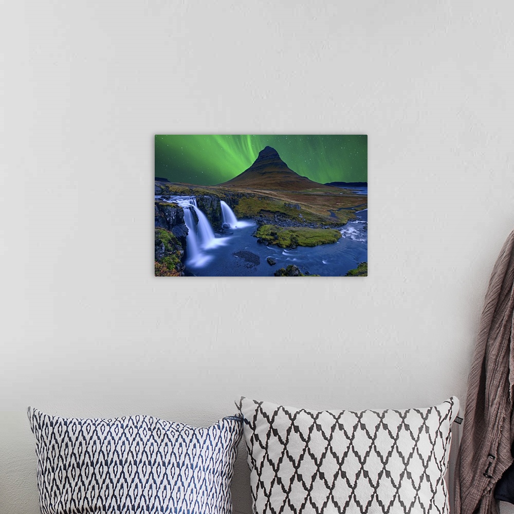A bohemian room featuring Northern lights over Kirkjufellfoss, with a stunning waterfall in the foreground.