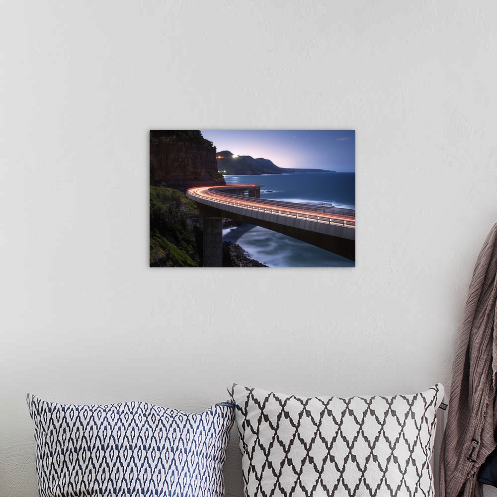 A bohemian room featuring Light trails from traffic on the Sea Cliff Bridge near Wollongong, Australia.