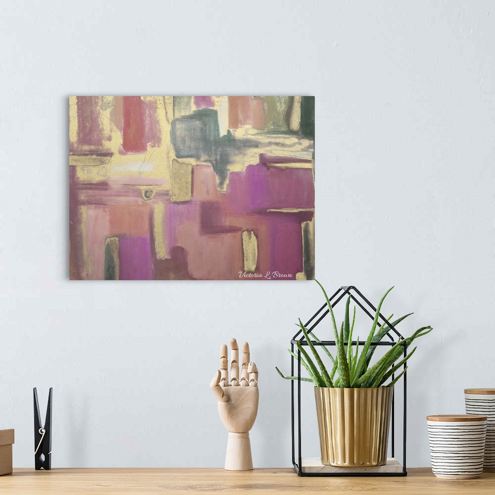 A bohemian room featuring Contemporary abstract home decor artwork using tones of pink and gold.